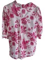 chemise motifs rose fushia sur fond blanc base des manches effet évasé.